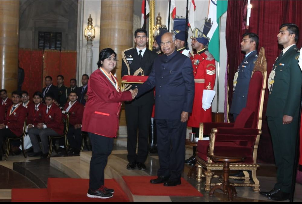 receiving the award from the President of India
